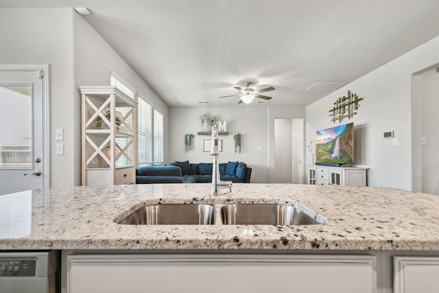 1904 Tomahawk Trl, Aubrey, TX 76227 - kitchen with a sink, open floor plan, ceiling fan, and light stone counters