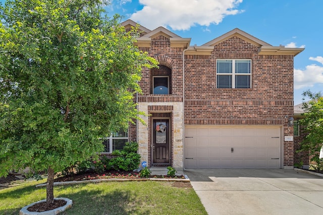 1904 Tomahawk Trl, Aubrey, TX 76227 - view of front of home with brick siding, concrete driveway, a garage, and a front yard