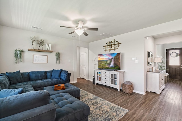 1904 Tomahawk Trl, Aubrey, TX 76227 - living area featuring dark wood-style floors, ceiling fan, and baseboards