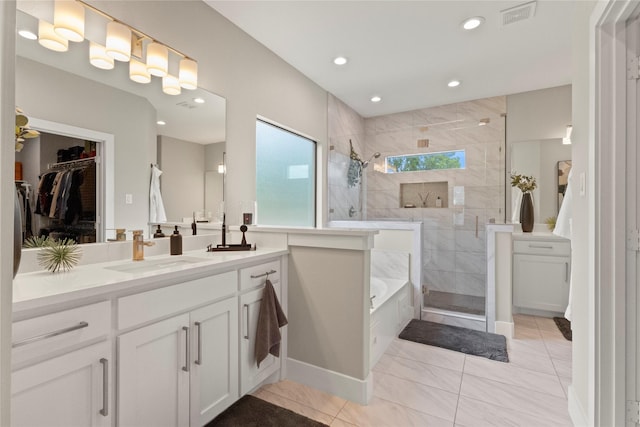 2027 Shaw St, Dallas, TX 75212 - full bathroom with a walk in shower, vanity, a bath, recessed lighting, and a walk in closet