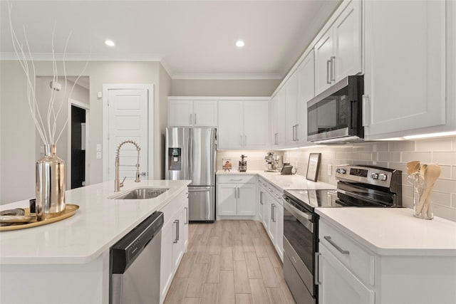 2027 Shaw St, Dallas, TX 75212 - kitchen with stainless steel appliances, a sink, crown molding, backsplash, and light countertops