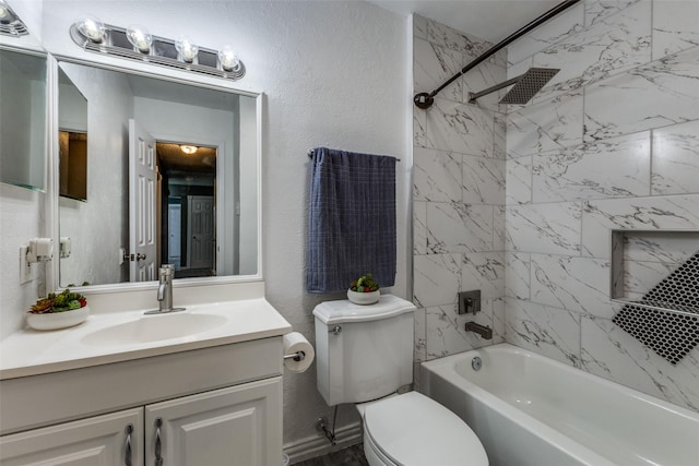 2929 Forest Park Dr, Garland, TX 75040 - full bathroom with vanity, washtub / shower combination, toilet, and a textured wall