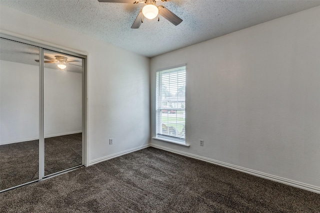 2929 Forest Park Dr, Garland, TX 75040 - unfurnished bedroom with carpet, a textured ceiling, a ceiling fan, baseboards, and a closet