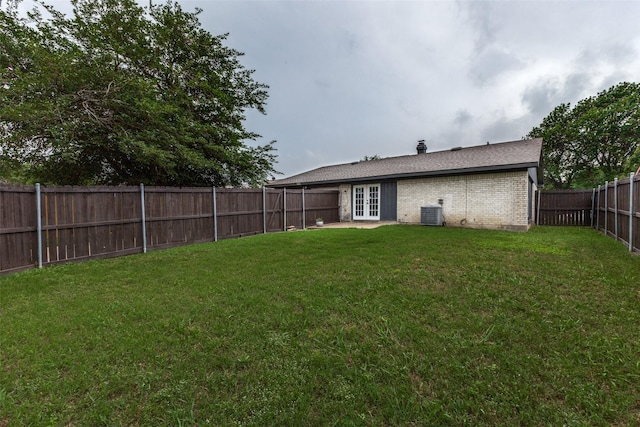 2929 Forest Park Dr, Garland, TX 75040 - view of yard with french doors and central AC unit