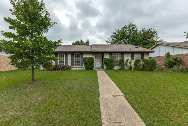 2929 Forest Park Dr, Garland, TX 75040 - ranch-style house featuring a front yard, brick siding, a chimney, and roof with shingles
