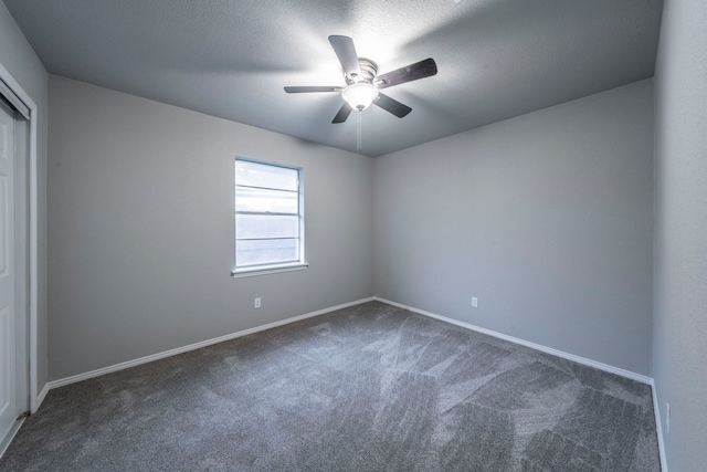 1725 Camara Ct, Grand Prairie, TX 75051 - spare room with dark colored carpet, a ceiling fan, and baseboards