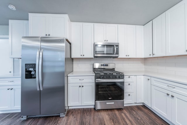 1725 Camara Ct, Grand Prairie, TX 75051 - kitchen featuring stainless steel appliances, dark wood-style flooring, light countertops, and decorative backsplash