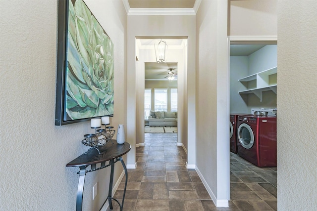 7314 Boulder Star Way, Temple, TX 76502 - corridor featuring washing machine and dryer, crown molding, dark stone finish floors, baseboards, and a textured wall