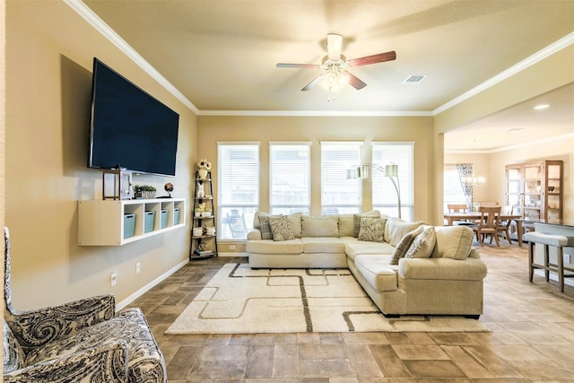 7314 Boulder Star Way, Temple, TX 76502 - living area with a ceiling fan, ornamental molding, stone finish floors, and baseboards