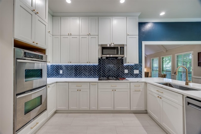 7207 Abrams Place Ct, Dallas, TX 75231 - kitchen with stainless steel appliances, a sink, crown molding, white cabinets, and tasteful backsplash