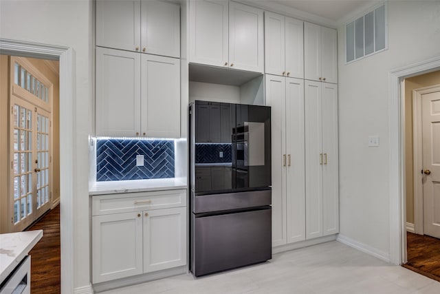 7207 Abrams Place Ct, Dallas, TX 75231 - kitchen featuring decorative backsplash, baseboards, light stone countertops, white cabinets, and smart refrigerator