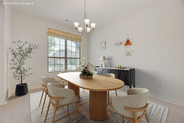 11130 Villa Canales Ln, Frisco, TX 75035 - dining room with a chandelier and baseboards