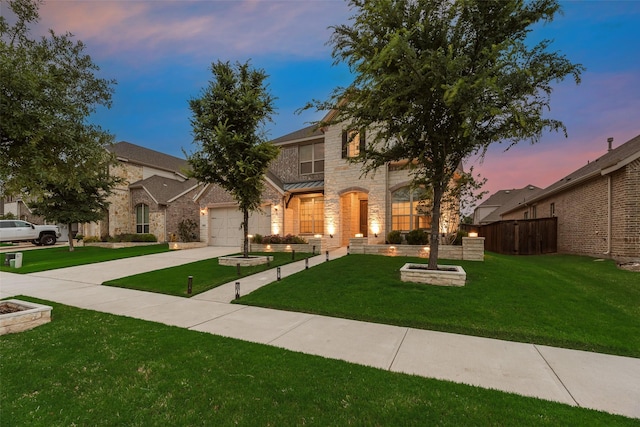 11130 Villa Canales Ln, Frisco, TX 75035 - view of front facade with stone siding, concrete driveway, and a garage