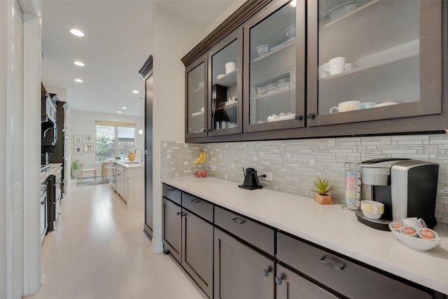 11130 Villa Canales Ln, Frisco, TX 75035 - bar area featuring tasteful backsplash, recessed lighting, a sink, and stainless steel appliances