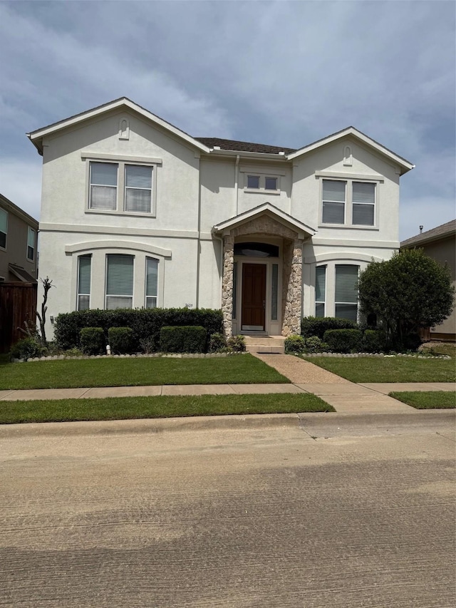 3609 University Park Ln, Irving, TX 75062 - traditional-style house with stucco siding, a front lawn, and stone siding