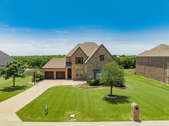 713 Calm Crest Dr, Rockwall, TX 75087 - french provincial home featuring an attached garage, driveway, brick siding, and a shingled roof