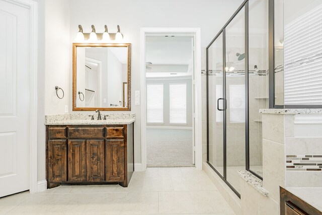 713 Calm Crest Dr, Rockwall, TX 75087 - bathroom with a shower stall, vanity, and tile patterned flooring