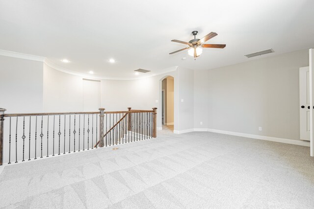 713 Calm Crest Dr, Rockwall, TX 75087 - spare room with a ceiling fan, arched walkways, crown molding, recessed lighting, and carpet