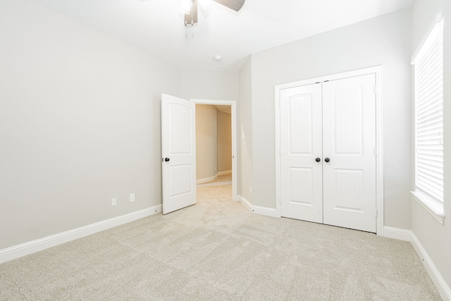 713 Calm Crest Dr, Rockwall, TX 75087 - unfurnished bedroom with carpet floors, a closet, baseboards, and ceiling fan