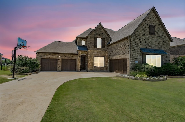 713 Calm Crest Dr, Rockwall, TX 75087 - french country style house featuring driveway, a yard, a garage, brick siding, and a shingled roof