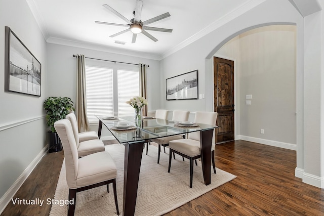 713 Calm Crest Dr, Rockwall, TX 75087 - dining area featuring wood finished floors, a ceiling fan, arched walkways, baseboards, and ornamental molding