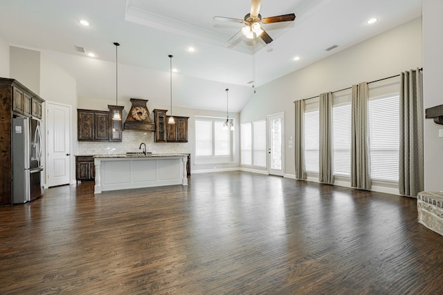 713 Calm Crest Dr, Rockwall, TX 75087 - unfurnished living room with recessed lighting, ceiling fan, dark wood-style flooring, a raised ceiling, and crown molding