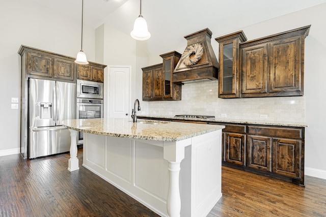 713 Calm Crest Dr, Rockwall, TX 75087 - kitchen featuring appliances with stainless steel finishes, a sink, custom exhaust hood, dark brown cabinets, and dark wood-type flooring