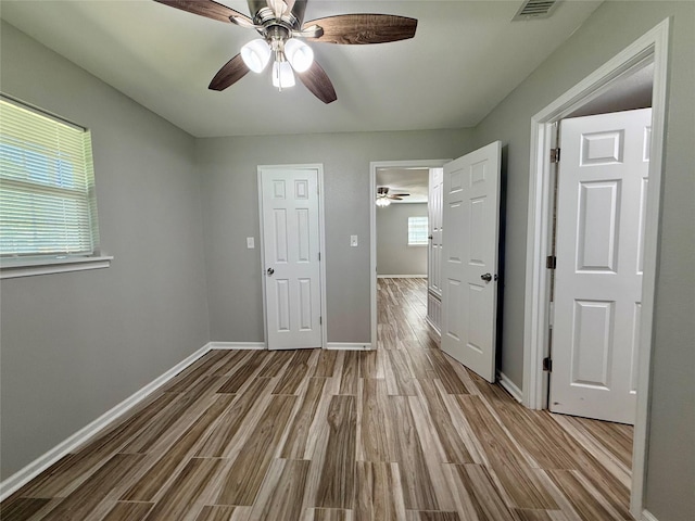 816 Bradleys Bnd, Tool, TX 75143 - unfurnished bedroom featuring wood finished floors, baseboards, and ceiling fan