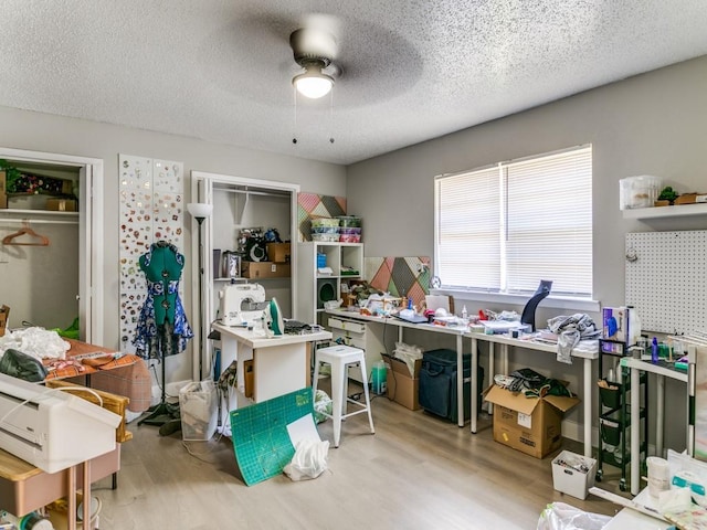 508 Billie Ruth Ln, Hurst, TX 76053 - home office with wood finished floors, ceiling fan, and a textured ceiling