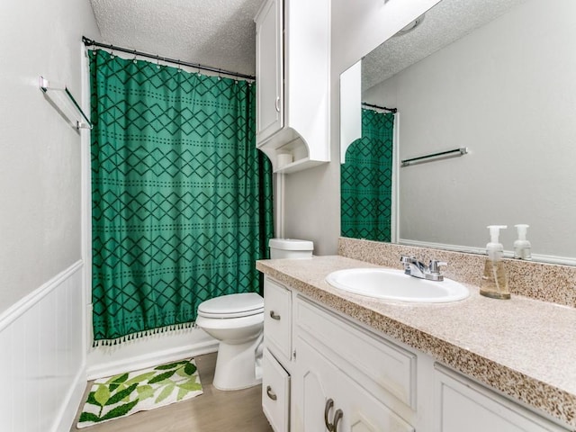 508 Billie Ruth Ln, Hurst, TX 76053 - full bath with a textured ceiling, toilet, vanity, and wood finished floors
