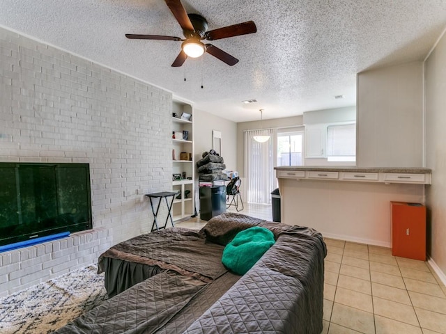 508 Billie Ruth Ln, Hurst, TX 76053 - living area with ceiling fan, a textured ceiling, light tile patterned floors, and baseboards