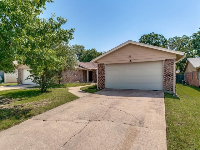 508 Billie Ruth Ln, Hurst, TX 76053 - view of front of property featuring brick siding, a front yard, and driveway