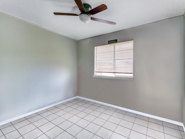 508 Billie Ruth Ln, Hurst, TX 76053 - spare room featuring ceiling fan, baseboards, light tile patterned flooring, and a textured ceiling