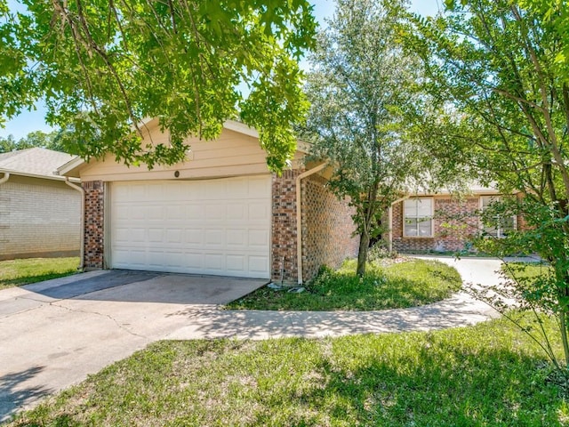 508 Billie Ruth Ln, Hurst, TX 76053 - view of front of property featuring brick siding, a garage, and concrete driveway