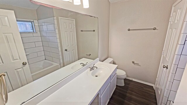 7305 Moon Ridge Ct, Fort Worth, TX 76133 - bathroom with baseboards, toilet, wood finished floors, and vanity
