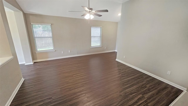 7305 Moon Ridge Ct, Fort Worth, TX 76133 - empty room with plenty of natural light, a ceiling fan, dark wood-style flooring, and vaulted ceiling
