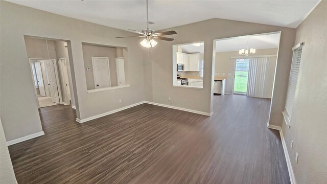 7305 Moon Ridge Ct, Fort Worth, TX 76133 - spare room featuring dark wood-style flooring, vaulted ceiling, a chandelier, a ceiling fan, and baseboards