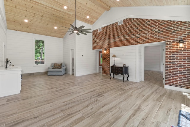 401 Tangle Dr, Tool, TX 75143 - living area featuring high vaulted ceiling, wooden ceiling, a ceiling fan, light wood-type flooring, and brick wall