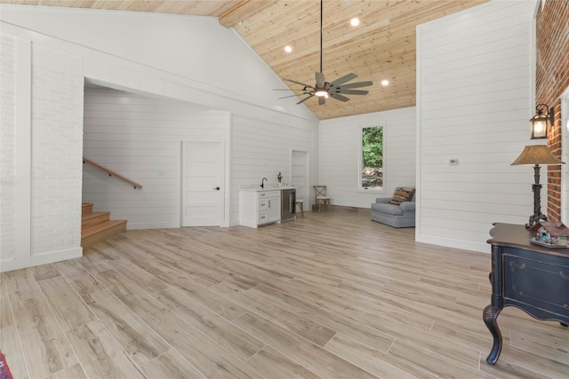 401 Tangle Dr, Tool, TX 75143 - living room with high vaulted ceiling, stairs, light wood-style flooring, a ceiling fan, and beam ceiling