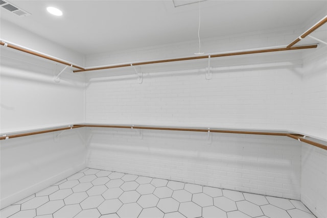 401 Tangle Dr, Tool, TX 75143 - spacious closet featuring light tile patterned floors and attic access