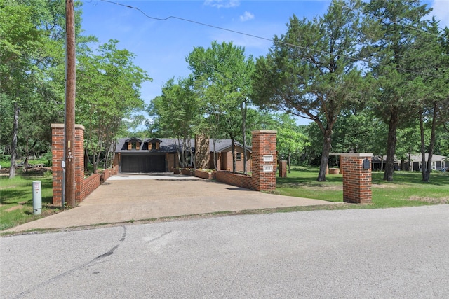 401 Tangle Dr, Tool, TX 75143 - view of front of property with driveway, a garage, and a front yard