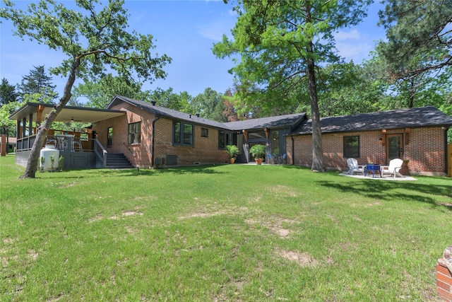 401 Tangle Dr, Tool, TX 75143 - back of house featuring brick siding, a lawn, and a porch