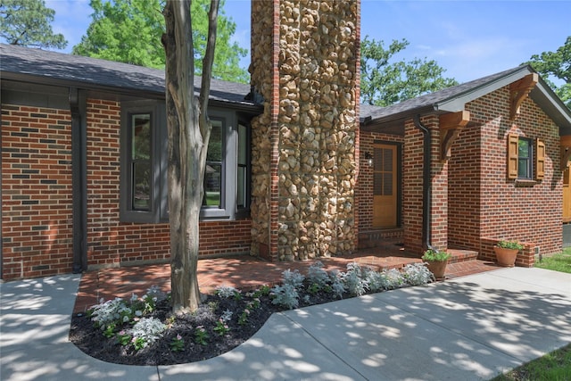 401 Tangle Dr, Tool, TX 75143 - view of property exterior featuring brick siding, a patio area, and a shingled roof