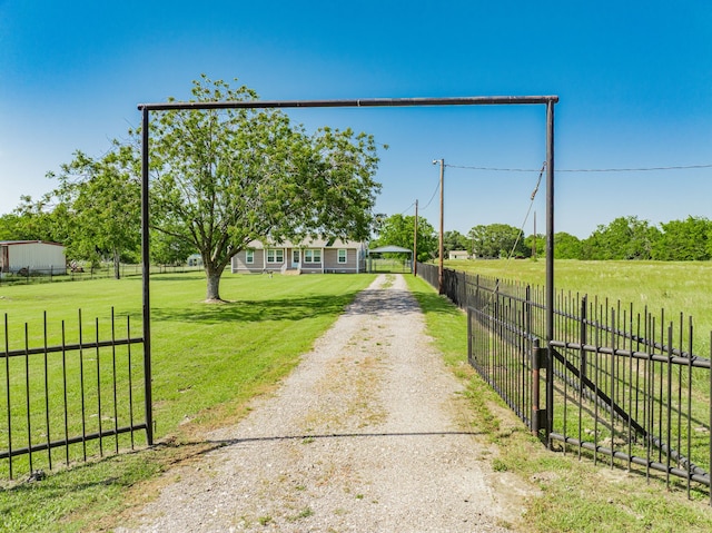7510 County Road 118, Kaufman, TX 75142 - view of dirt / gravel driveway featuring a gated entry