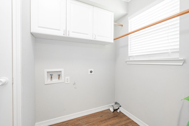 7510 County Road 118, Kaufman, TX 75142 - washroom with electric dryer hookup, hookup for a washing machine, baseboards, cabinet space, and dark wood finished floors