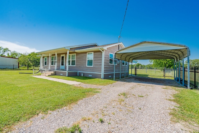7510 County Road 118, Kaufman, TX 75142 - manufactured / mobile home with driveway, covered porch, and a detached carport