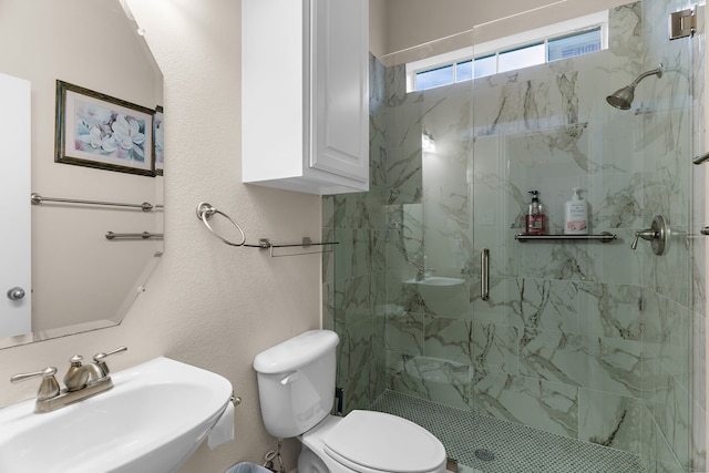1730 Monaco Dr, Allen, TX 75002 - bathroom featuring a sink, a marble finish shower, and toilet