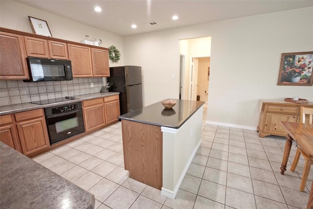 908 Reveille Rd, Fort Worth, TX 76108 - kitchen with black appliances, decorative backsplash, light tile patterned floors, recessed lighting, and a center island
