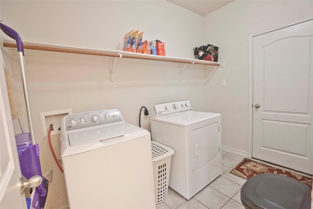 908 Reveille Rd, Fort Worth, TX 76108 - clothes washing area with washer and dryer, light tile patterned floors, and baseboards