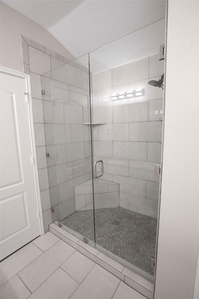 908 Reveille Rd, Fort Worth, TX 76108 - full bathroom with a stall shower, tile patterned floors, and vaulted ceiling